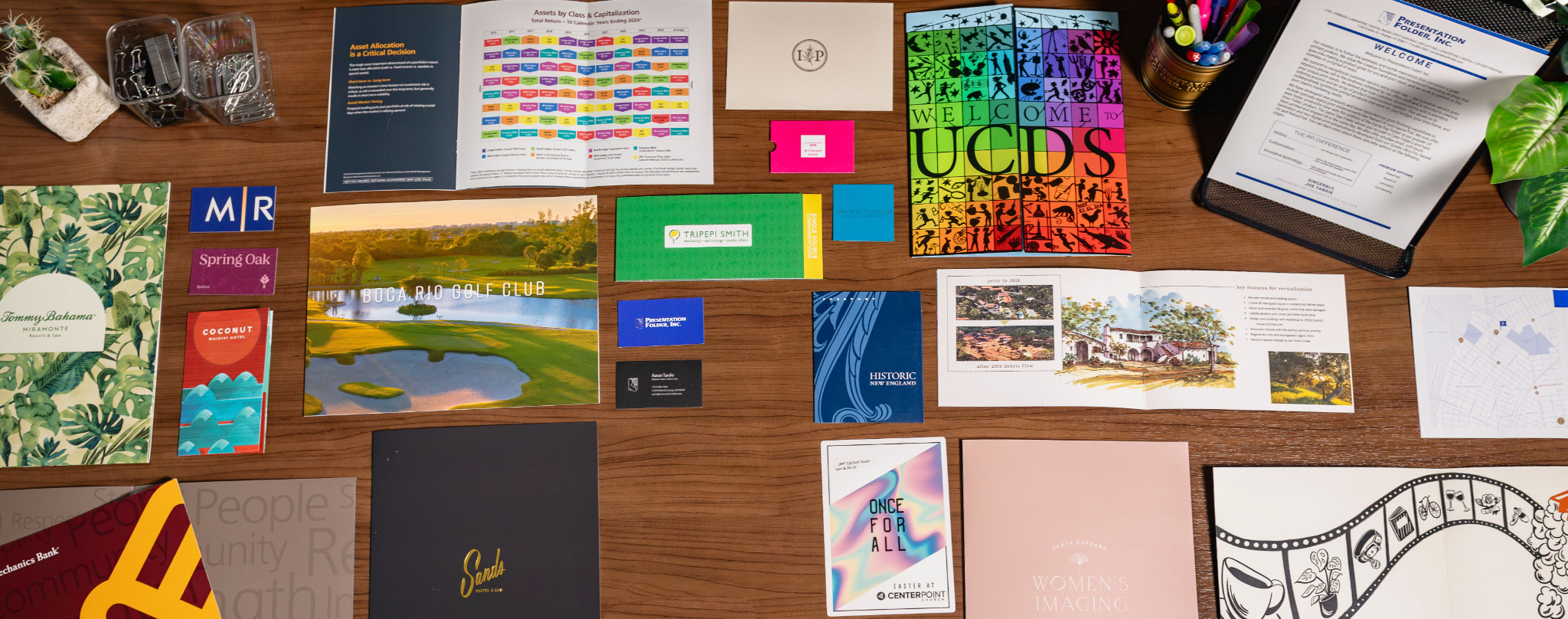 Assortment of Presentation Folder printed products including folders, cards, packaging, and booklets